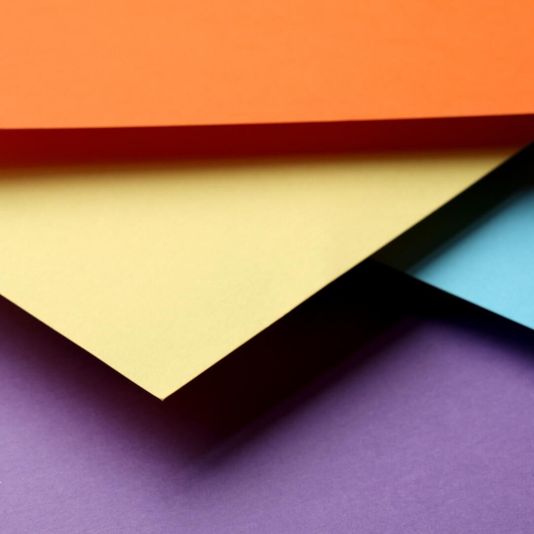 Colourful paper stacked on top of each other